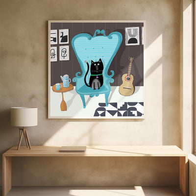 Cute Black Cat sitting on Blue Armchair by Artist Carla Daly - Stretched Canvas, Poster or Fine Art Print I Heart Wall Art